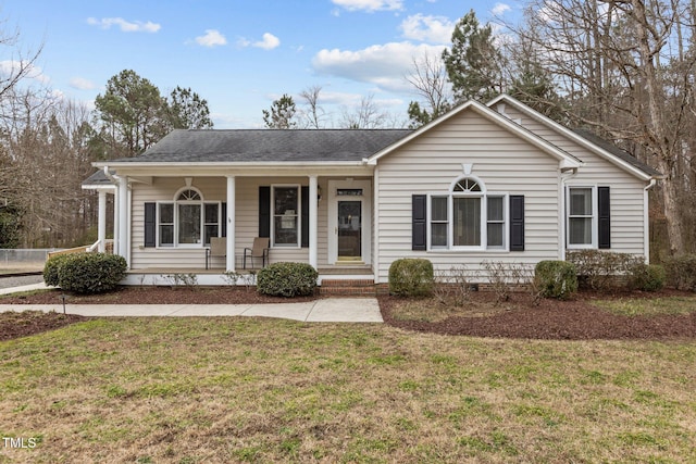 single story home featuring a front yard and covered porch