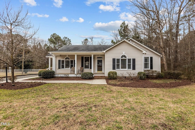 single story home with covered porch and a front yard