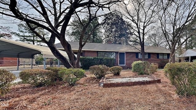 ranch-style home with a carport