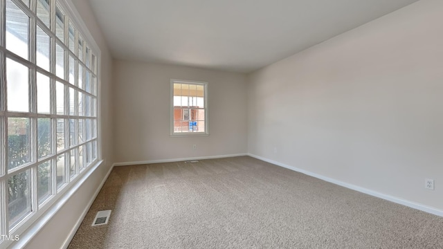 empty room featuring carpet flooring