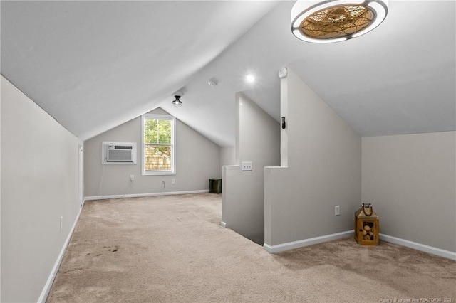 additional living space featuring lofted ceiling, light colored carpet, and an AC wall unit