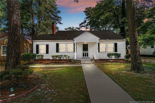 ranch-style house with a lawn