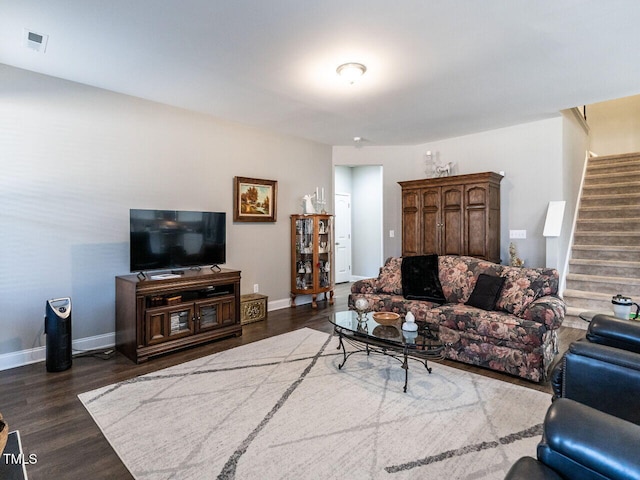 living room with dark hardwood / wood-style flooring