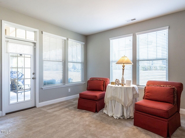 sitting room with light colored carpet