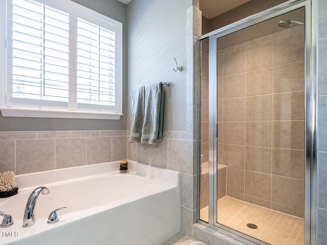 bathroom with independent shower and bath