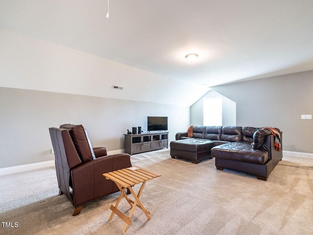 carpeted living room with lofted ceiling