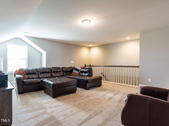 living room featuring light colored carpet and lofted ceiling