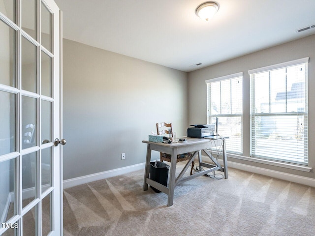 home office with light carpet