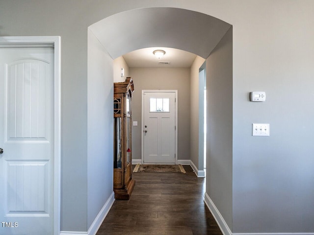 13 Needham Ln, Clayton, NC 27527 - entryway with arched walkways, baseboards, and dark wood-type flooring
