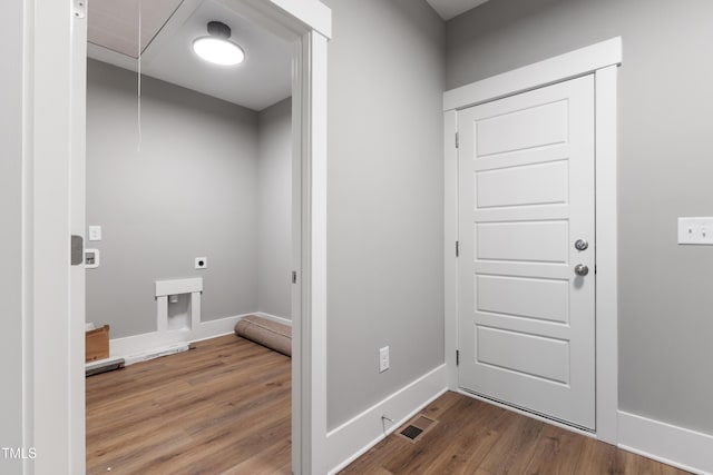 clothes washing area with electric dryer hookup and hardwood / wood-style floors