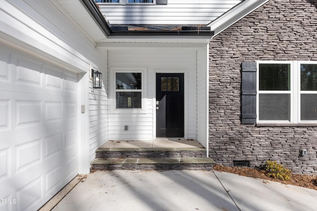 entrance to property with a garage