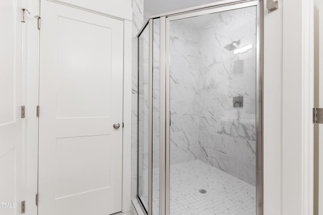 bathroom featuring an enclosed shower