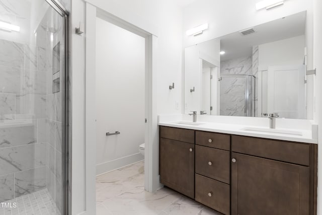 bathroom featuring vanity, toilet, and walk in shower