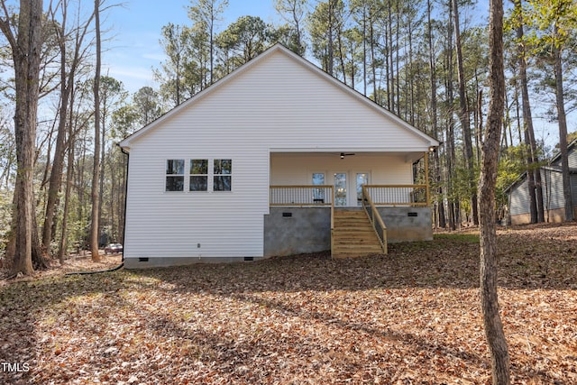 rear view of property with a porch and french doors