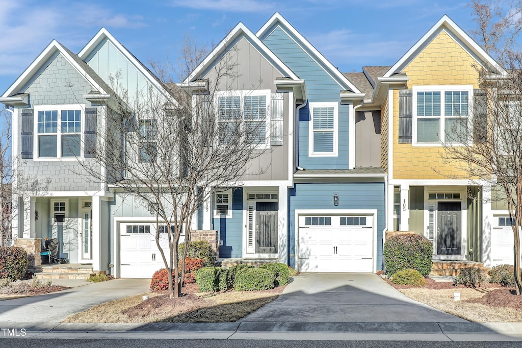 multi unit property featuring a garage