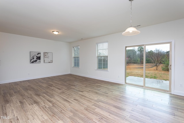 spare room featuring light wood-type flooring