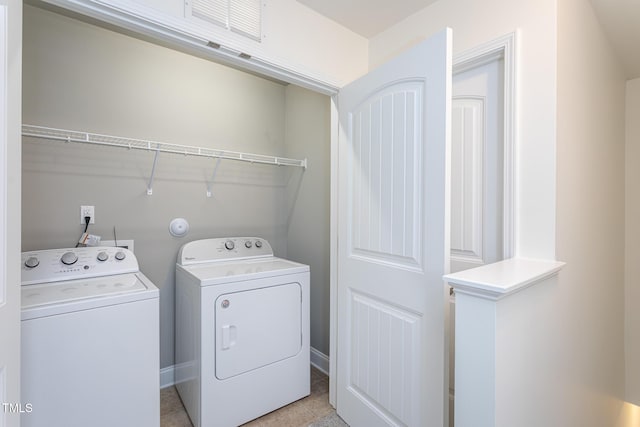 washroom with washer and dryer