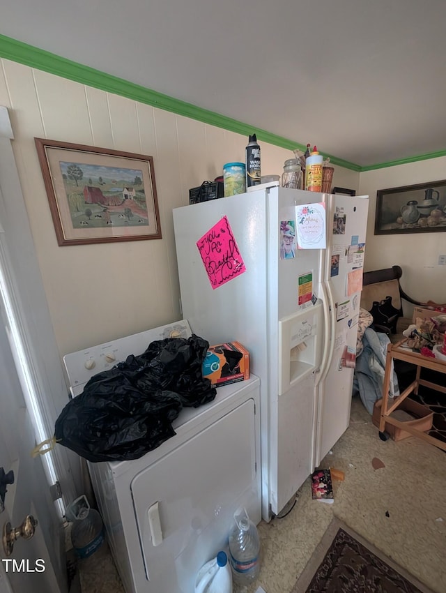 kitchen with washer / clothes dryer and white fridge with ice dispenser