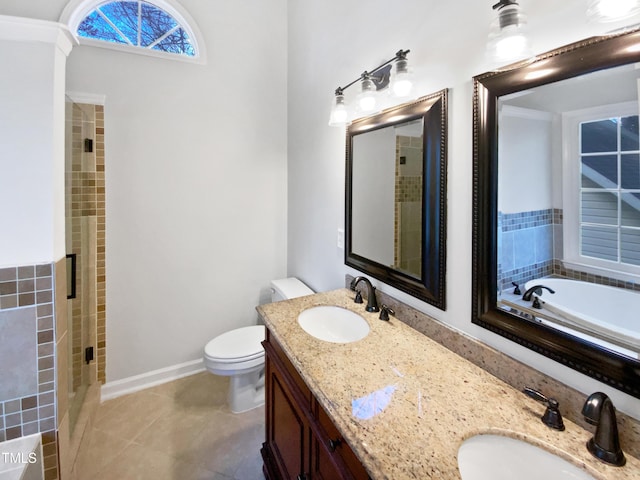 full bathroom featuring tile patterned flooring, shower with separate bathtub, vanity, and toilet