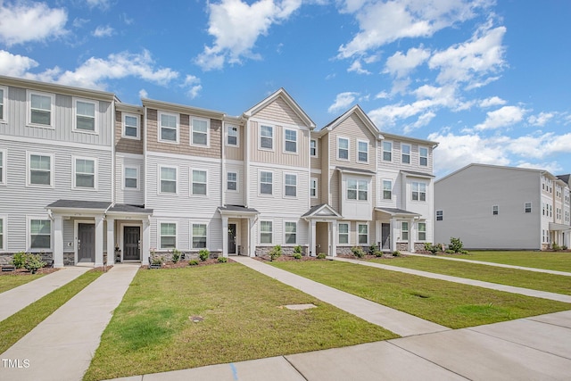 2708 Chert Ln, Raleigh, NC 27610 - view of property with stone siding, a residential view, and a front yard