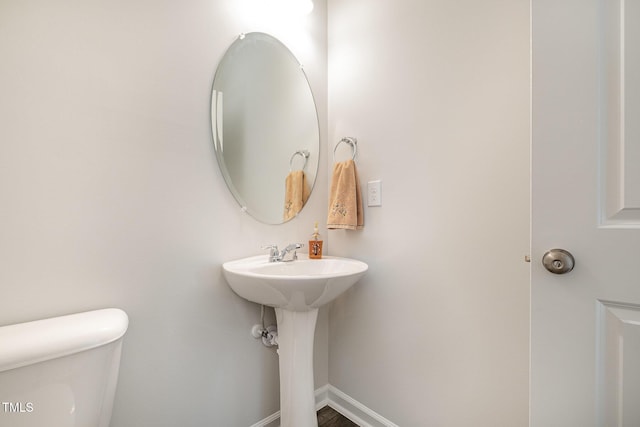 2708 Chert Ln, Raleigh, NC 27610 - half bathroom with toilet and baseboards