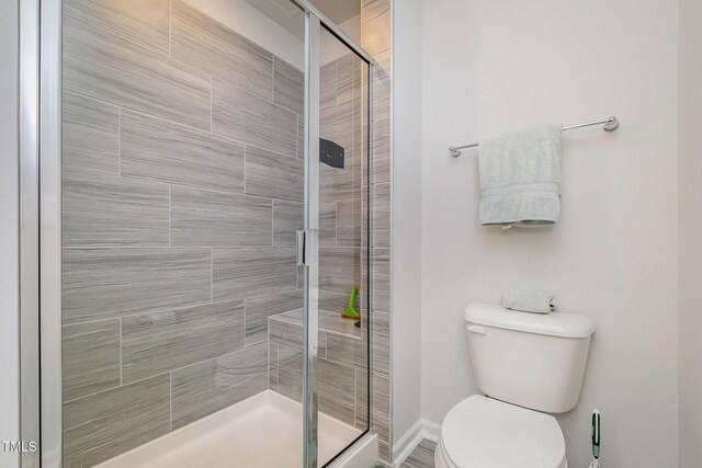 2708 Chert Ln, Raleigh, NC 27610 - bathroom featuring a shower stall and toilet