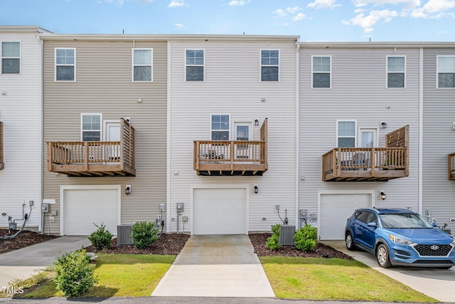 2708 Chert Ln, Raleigh, NC 27610 - back of house with an attached garage and driveway