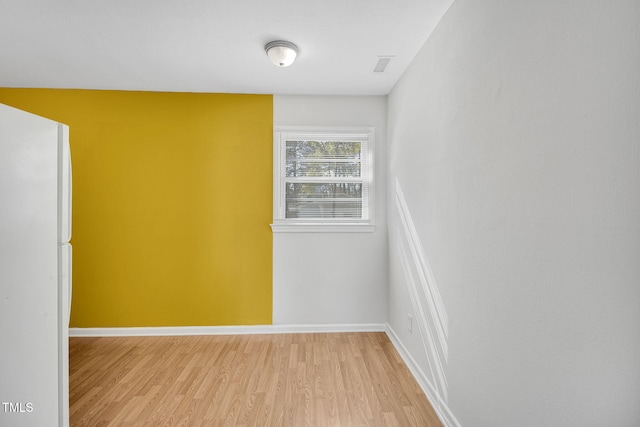 unfurnished room featuring light hardwood / wood-style floors