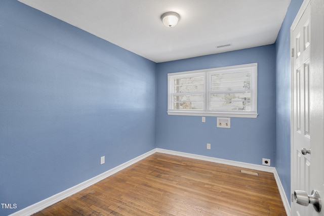 unfurnished room featuring hardwood / wood-style floors