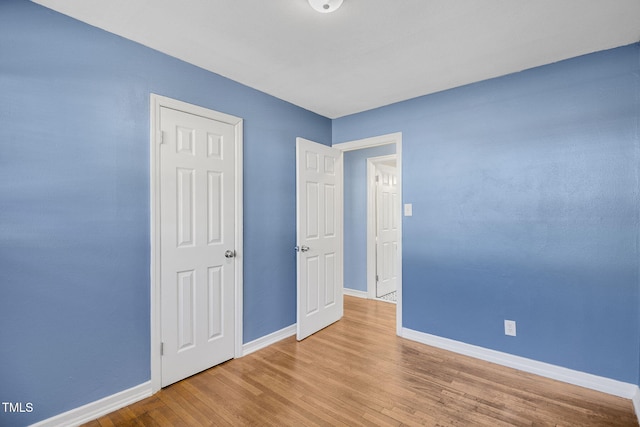 unfurnished bedroom with light hardwood / wood-style floors