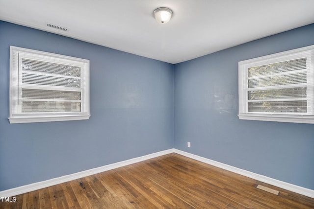 empty room featuring hardwood / wood-style floors