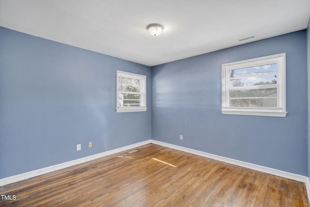 empty room featuring hardwood / wood-style floors