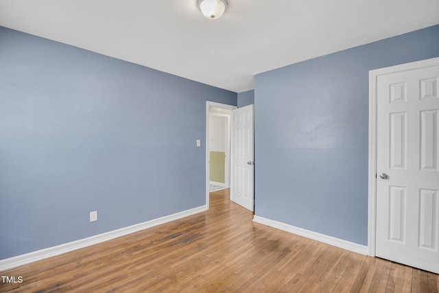 unfurnished bedroom with wood-type flooring