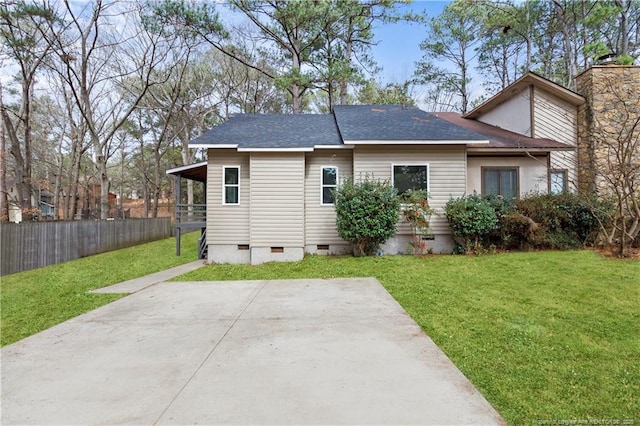 rear view of house featuring a yard and a patio area