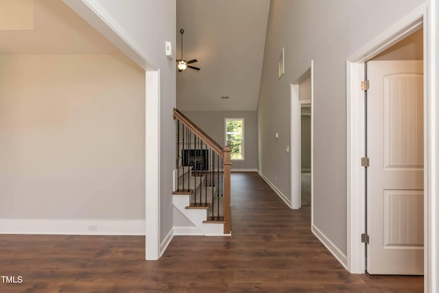 staircase with hardwood / wood-style floors and ceiling fan