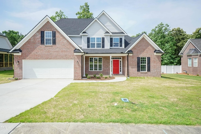 view of front of property with a garage and a front lawn