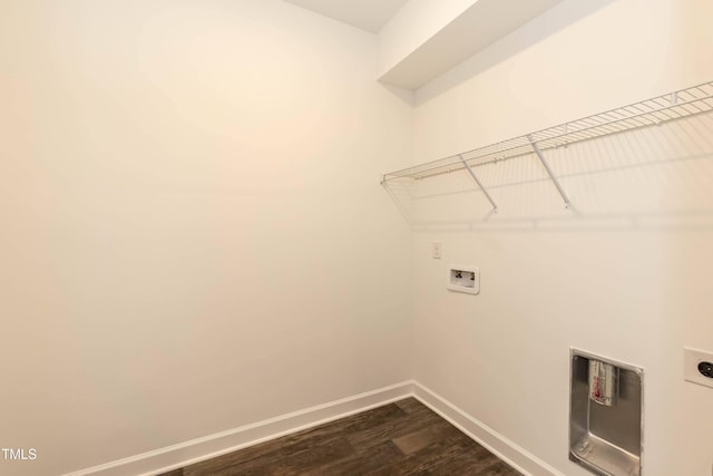 laundry room featuring hookup for a washing machine, electric dryer hookup, and dark wood-type flooring