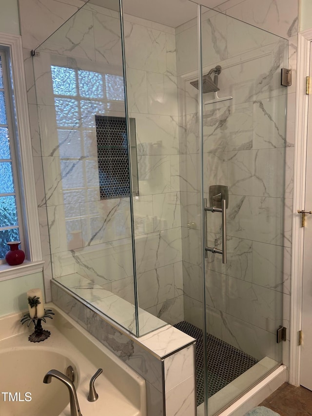 bathroom with shower with separate bathtub