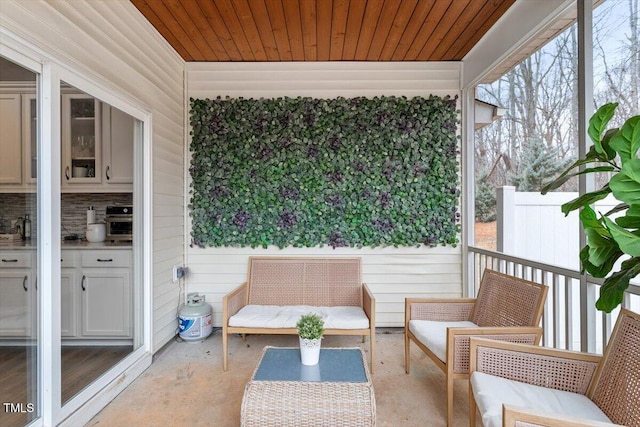 unfurnished sunroom with wooden ceiling