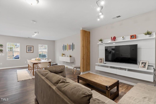 living room featuring track lighting and hardwood / wood-style floors