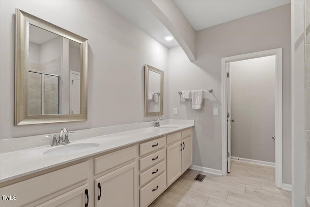 bathroom with vanity and an enclosed shower