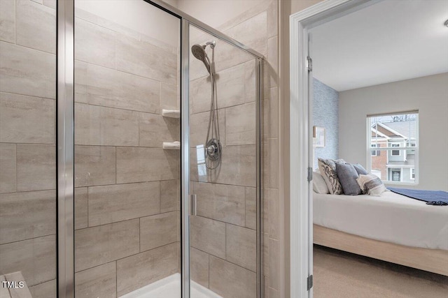 bathroom featuring a shower with shower door