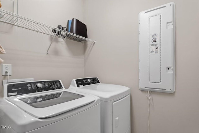 laundry room with washing machine and dryer