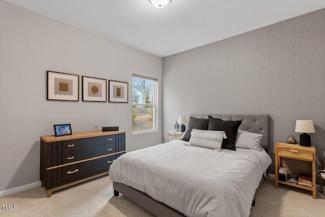 bedroom with light colored carpet