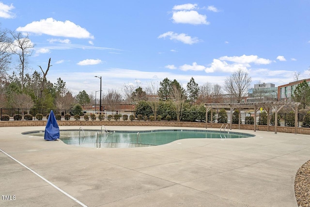 view of swimming pool featuring a pergola