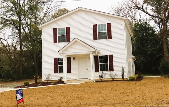 view of front of home with a front lawn