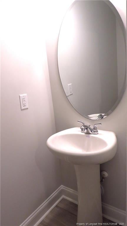 bathroom featuring sink and wood-type flooring