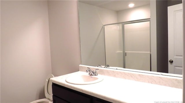 bathroom with vanity and an enclosed shower