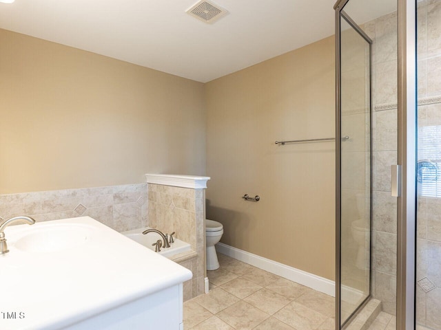 bathroom with plus walk in shower, tile patterned floors, and toilet