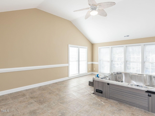 interior space featuring vaulted ceiling and ceiling fan